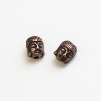 kovova-koralka-hlava-buddha-medena